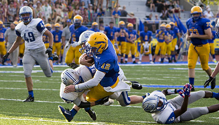 Varsity football team loses to Carmel 14-7 in season opener Friday, Aug. 22.