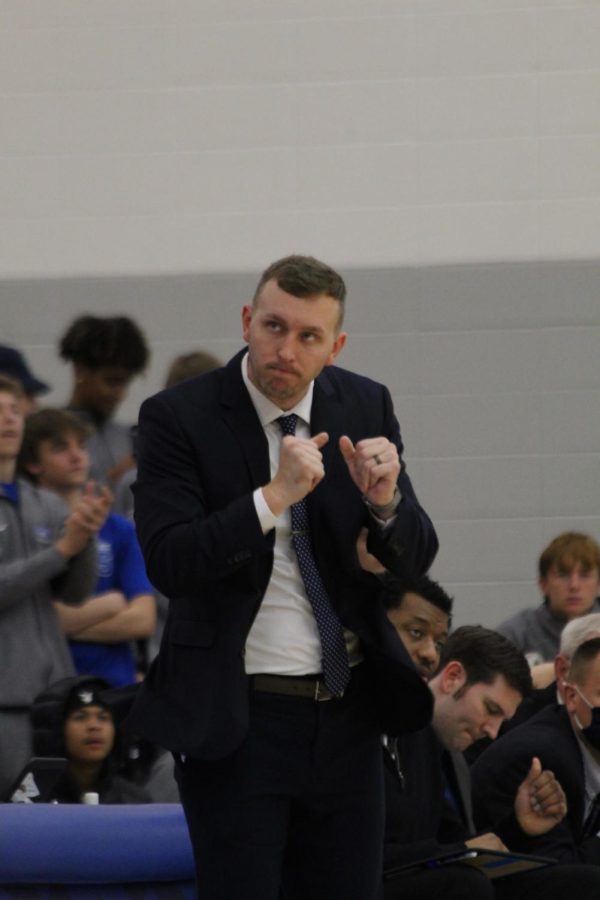 Coach Ashworth celebrating a basket