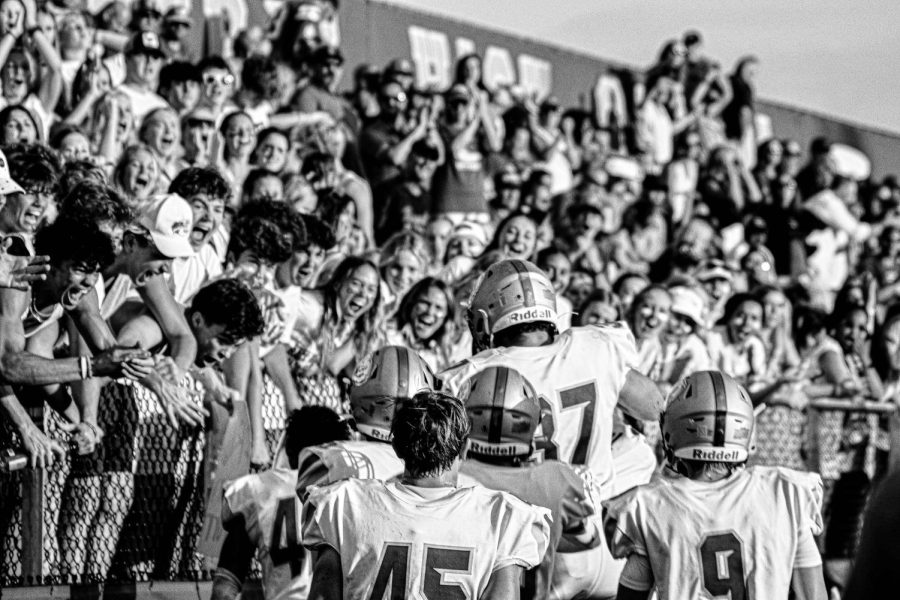 HSE football players celebrate road victory over LC with fans