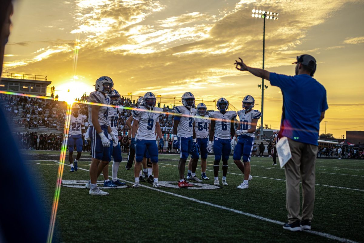 Hamilton southeastern defensive coordinator, Jordan Mcaslin, signaling to the defense before taking the field. 