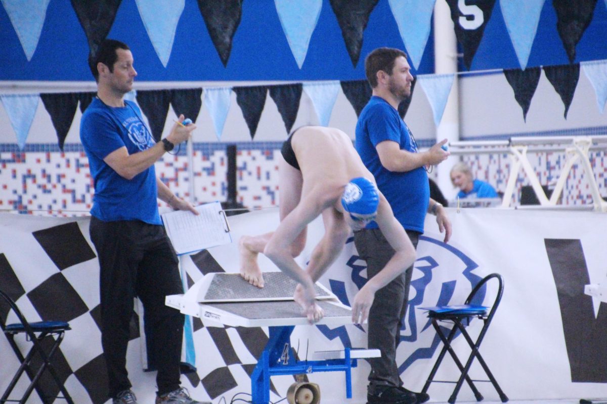 Sophomore Camden Bailey dives in from lane 4 to start his 200 freestyle. Bailey was 2nd in the race with a time of 1:52.42. 