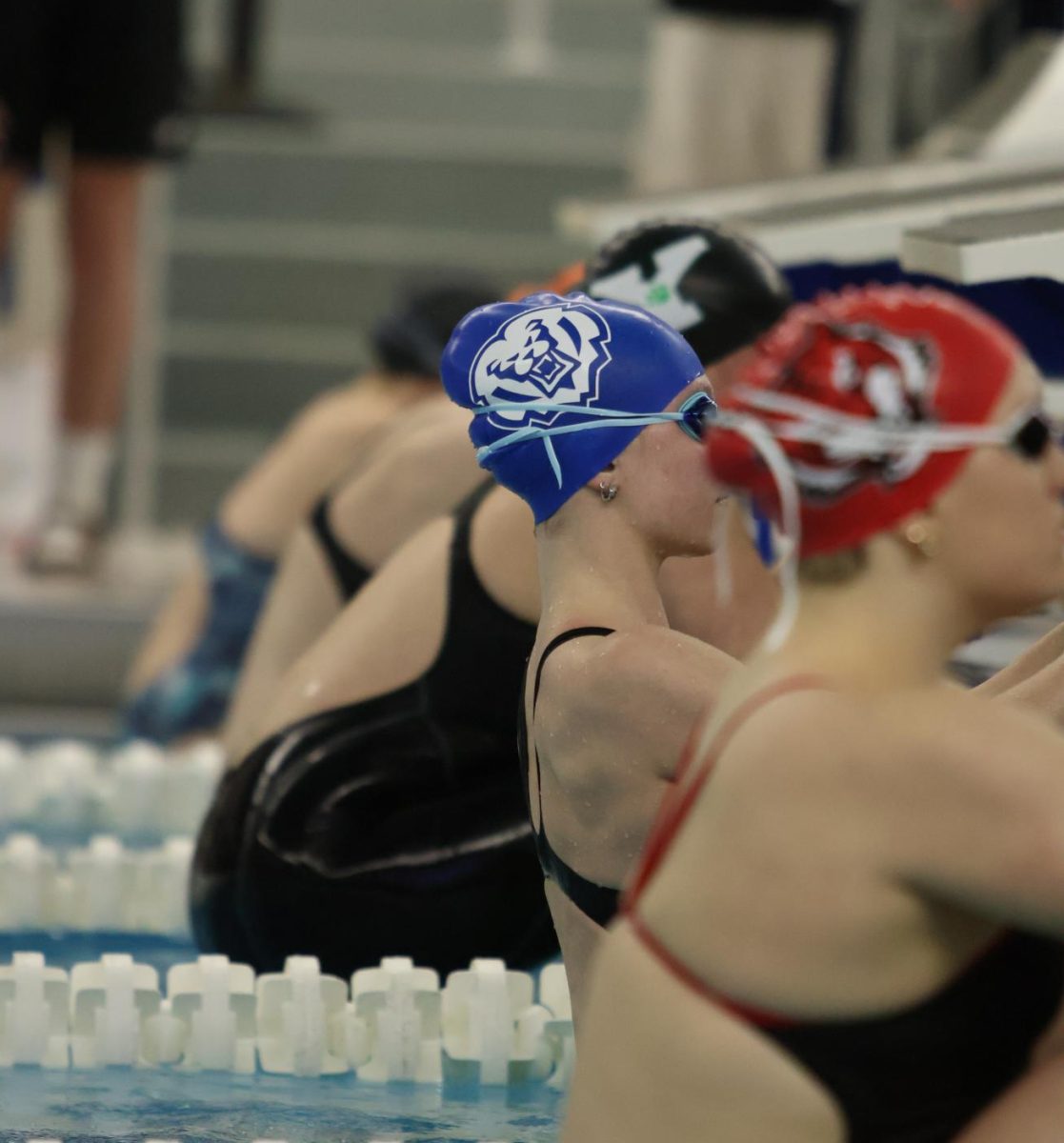 Junior, Kelsey Graham, about to start swimming backstroke. 