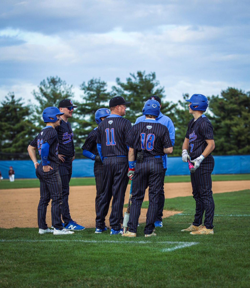 HSE baseball coach meeting with palyers before game