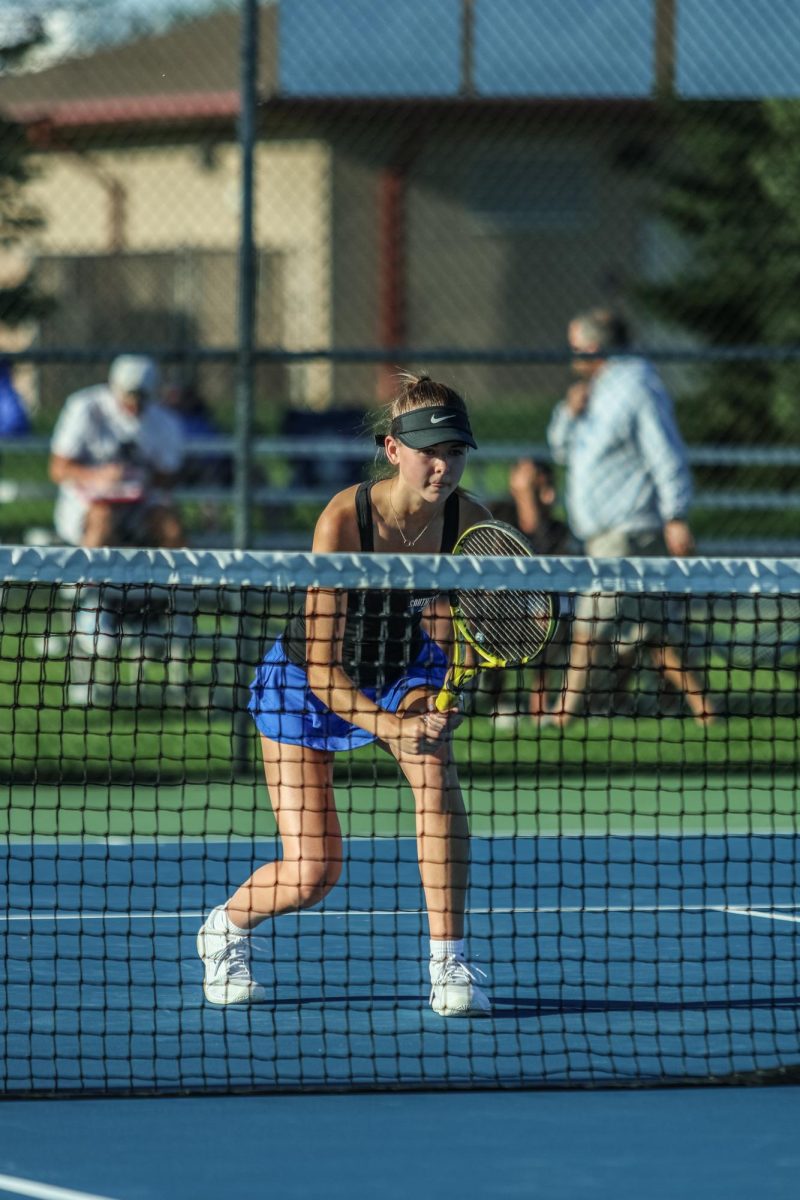 Senior Peighton Baugh Readies for the North Central Serve