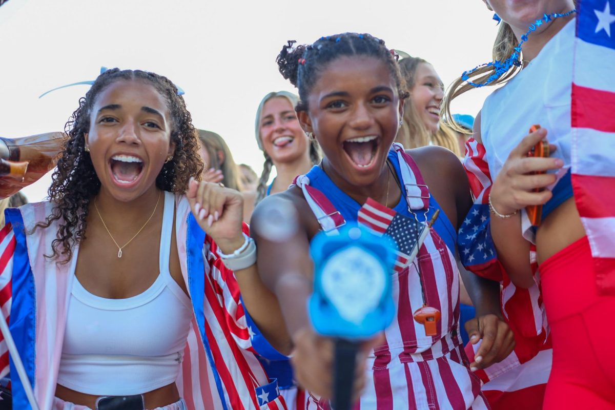 Two Blue Crew leaders celebrate their team, decked out in U.S.A gear to match the game theme.