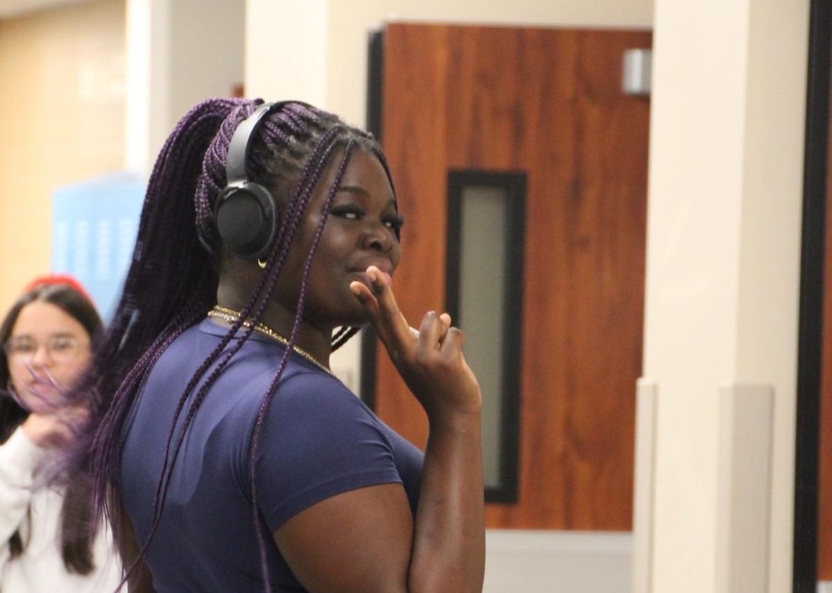 Mame Fall (12) strikes a pose in the hallway on Thursday, September 5th.