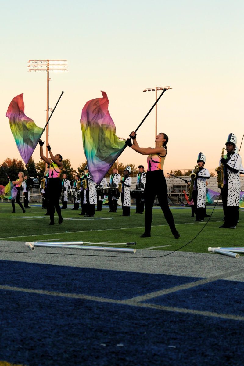 Photo of two color guard performers during the community night performance. 