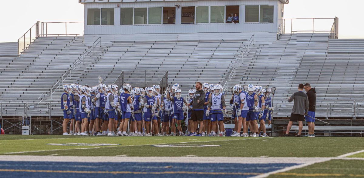 HSE Lacrosse Team in a Huddle in Practice