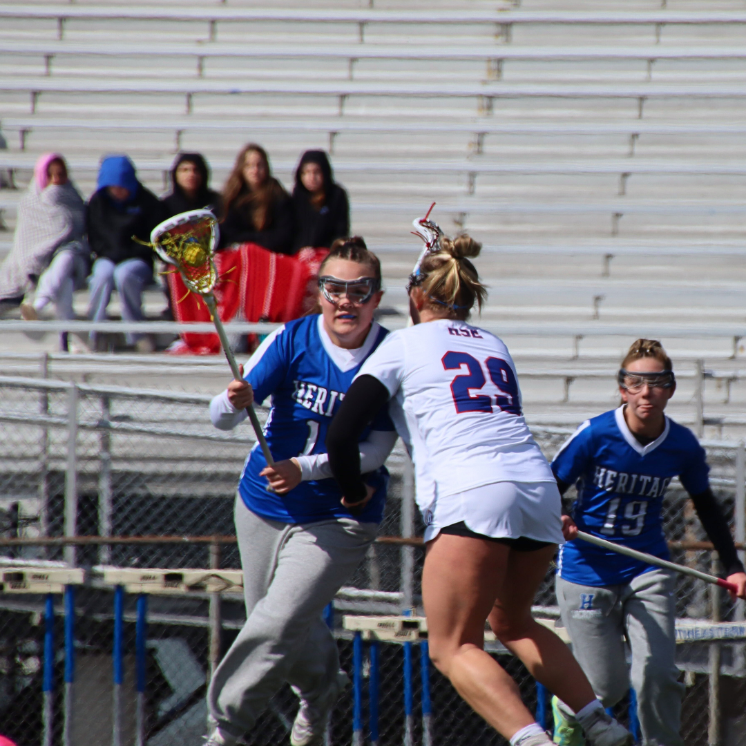 Junior Norah Brandenburg, uses her strength to keep the defense on her hip.