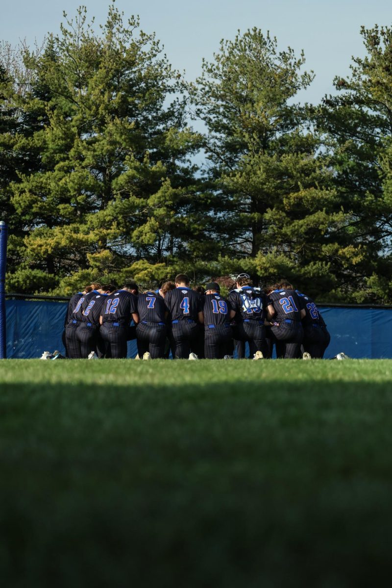 HSE Varsity Baseball Team Huddles Before The Game