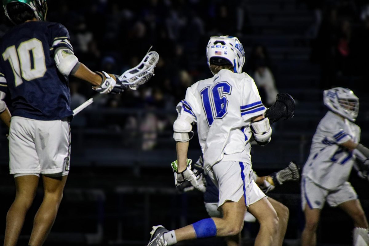 Junior Nick Webber runs towards the ball to try and help his teammates out.