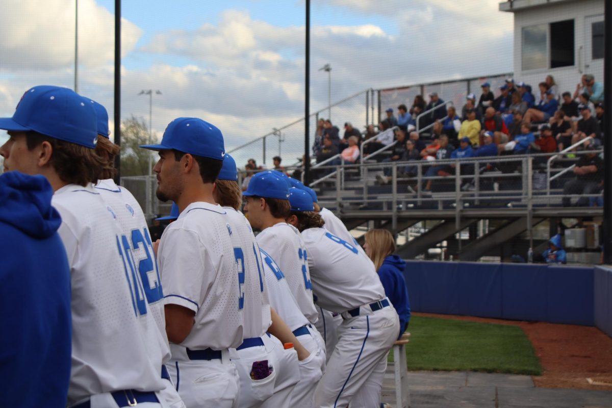 The Boys watch as their team strikes out the other team 