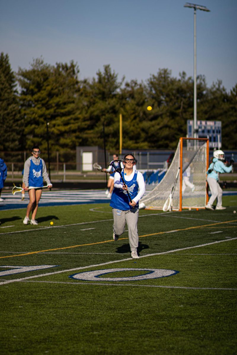 Teammate catching ball from other teammate