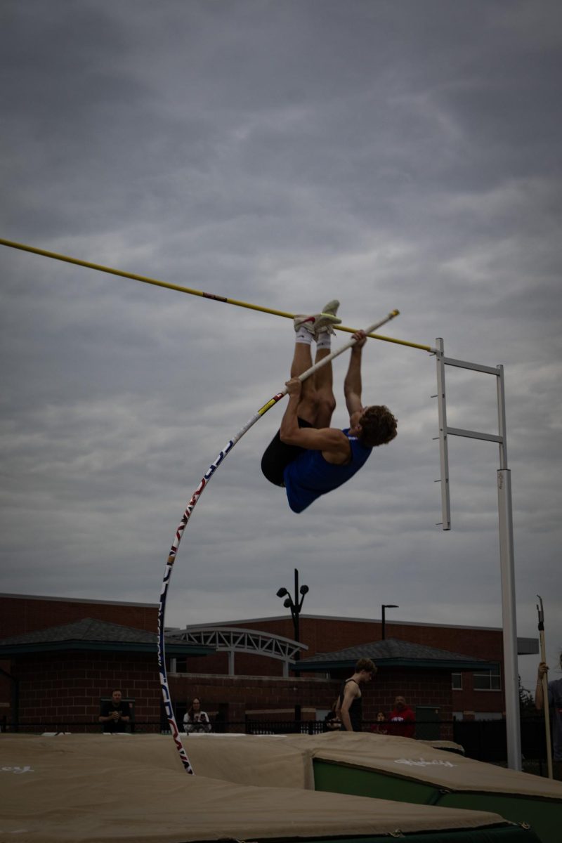 Freshman Andrew Krohn springs over the pole and getting 6th place in pole vault 