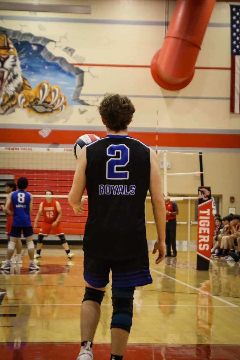 Junior Sean Smart serves the ball to fishers.