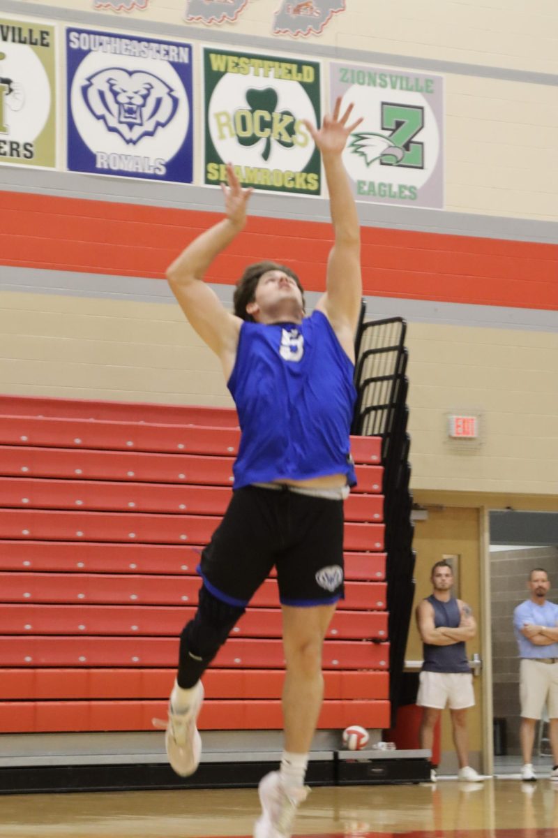 Senior Jackson Campbell jump serves the ball.