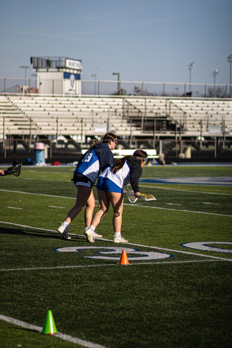 Defensive players practicing blocking