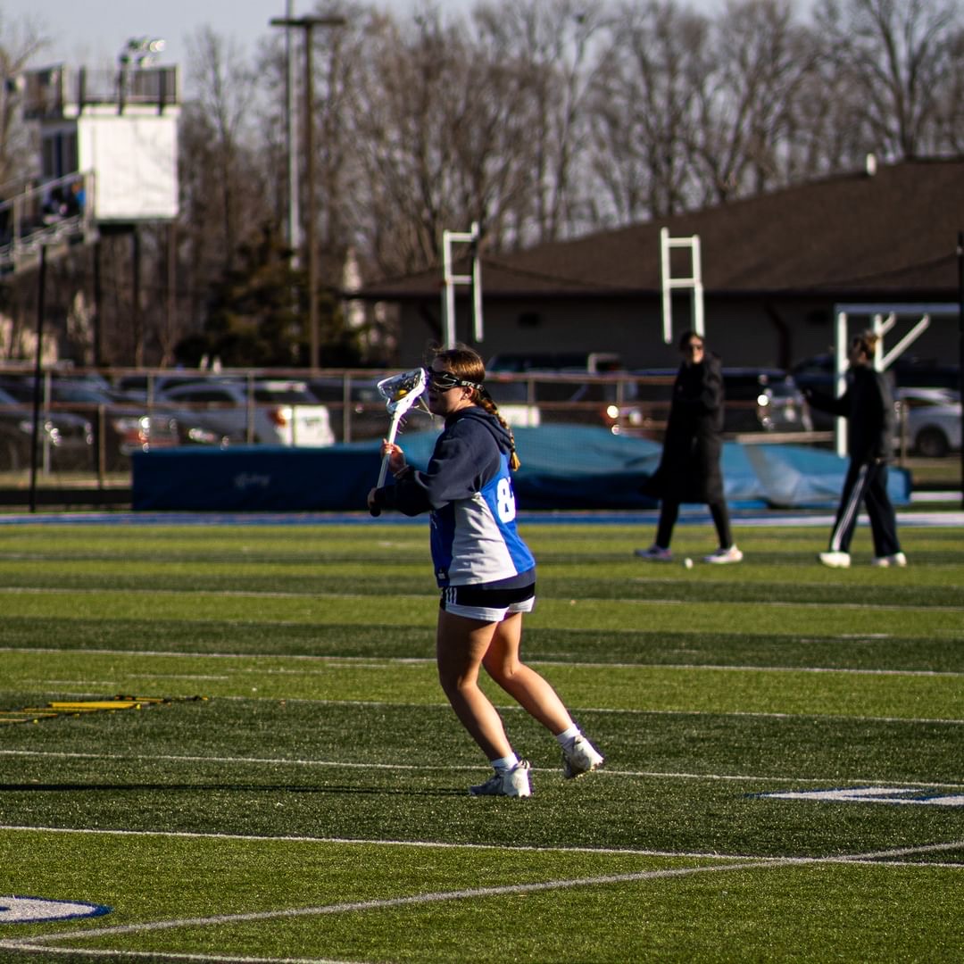 Teammate practicing passing drills