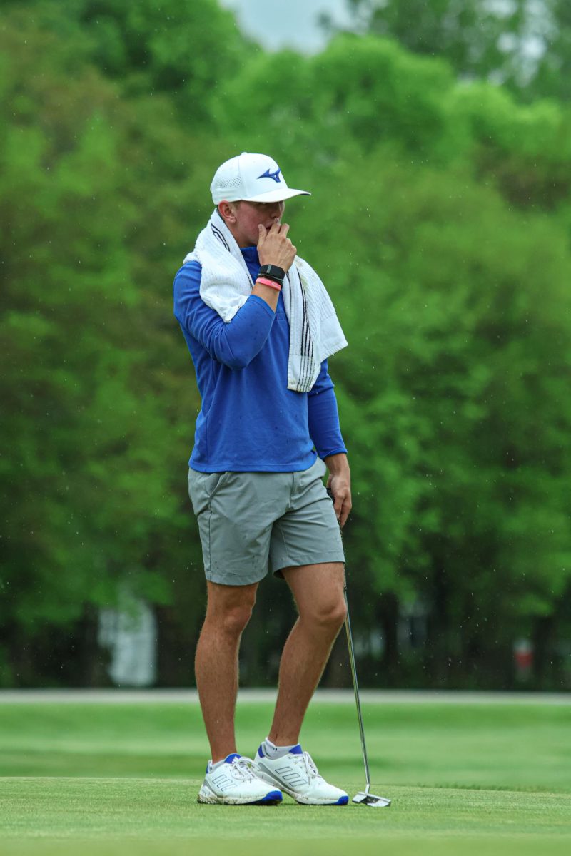 Junior, Kai Warner Scopes out the Green Before his Putt at Fall Creek Golf Club on May 9th, 2024