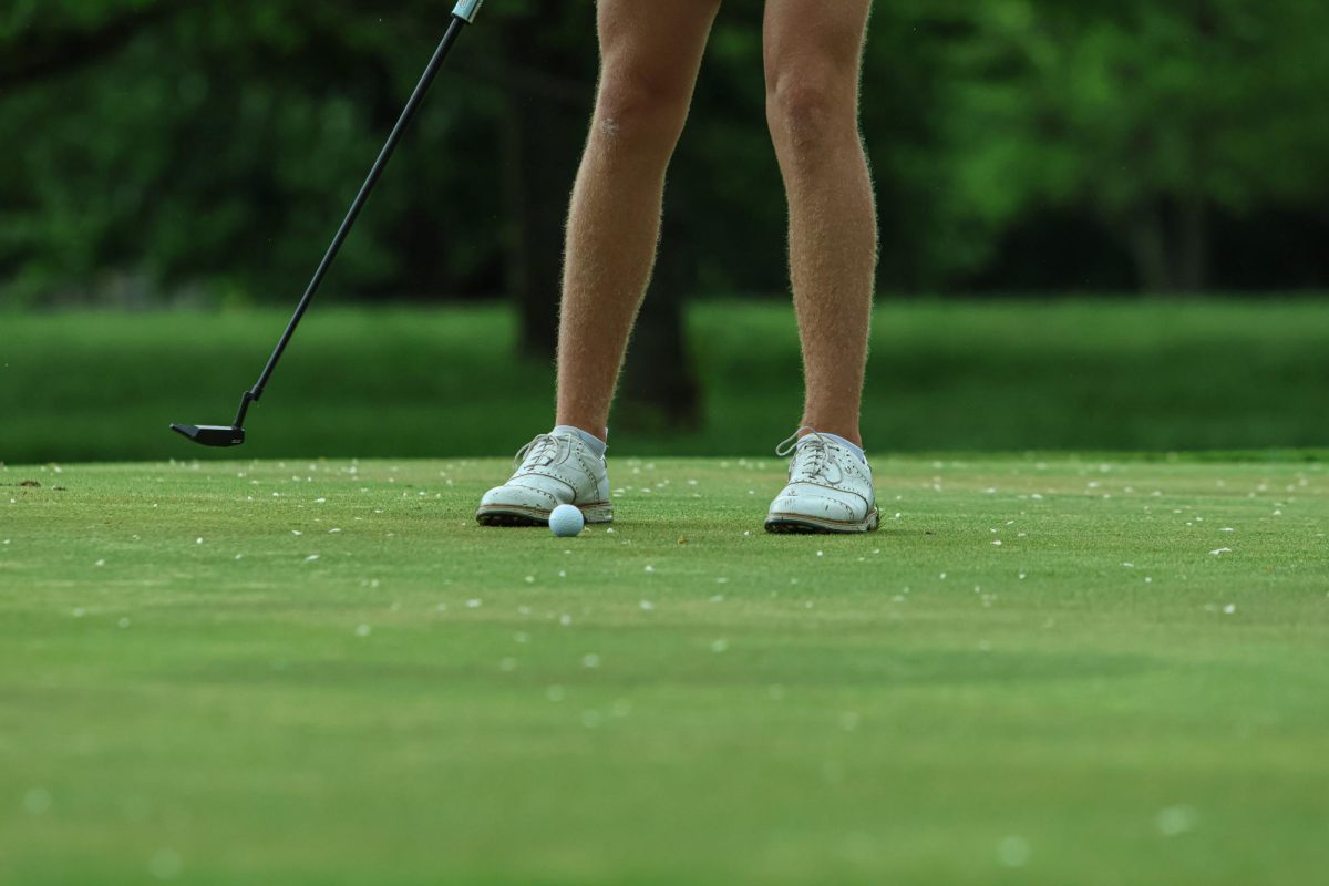 Freshman, Brody Colburn putts the ball at Fall Creek Golf Club on May 9th, 2024