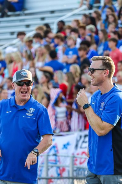 Athletic Directors Drew Tower and Jim Self share a laugh at the USA-themed football scrimmage on August 16 against Bishop Chatard.