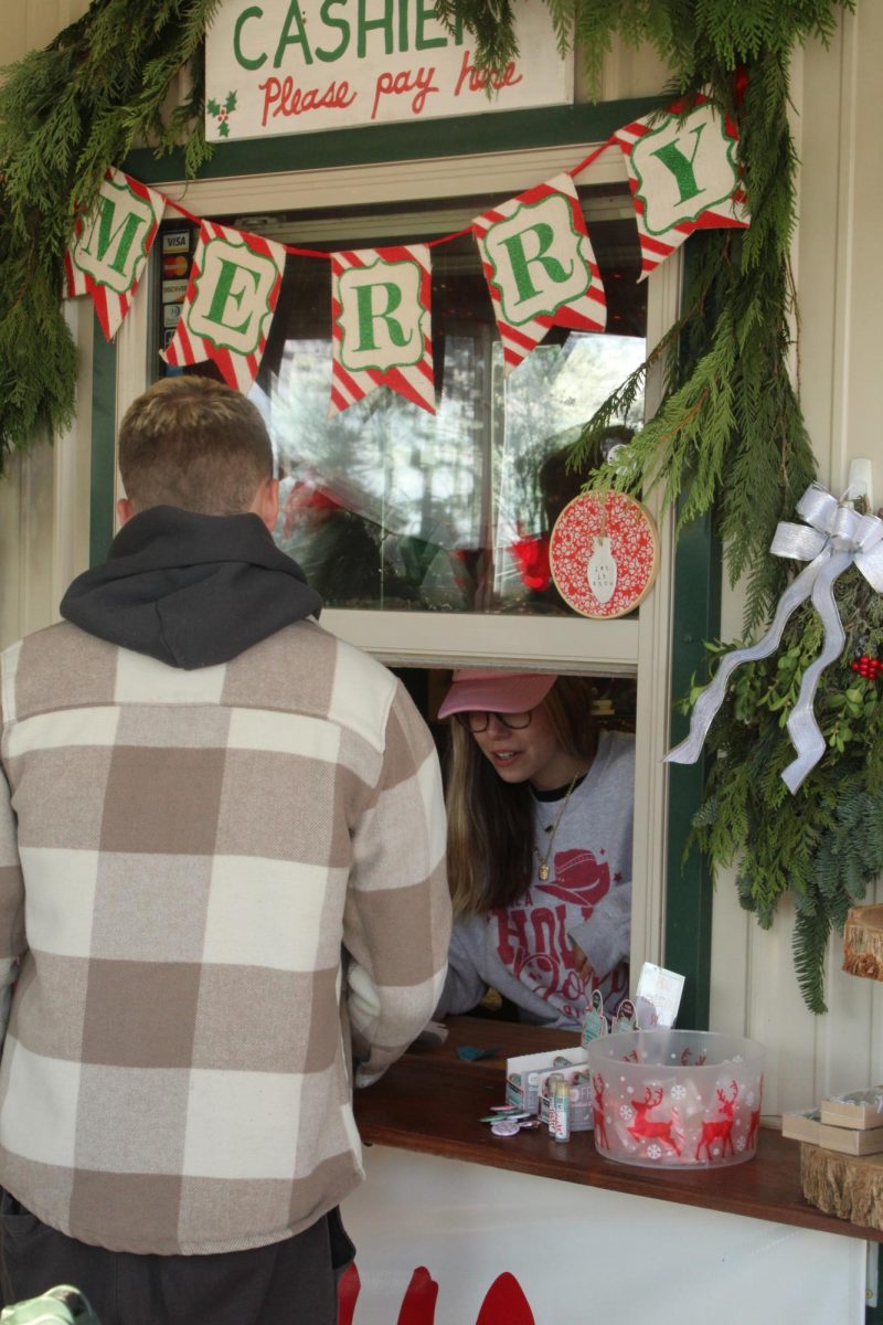 Erin Sambol makes a sale to a customer at Sambol’s Tree Farm.