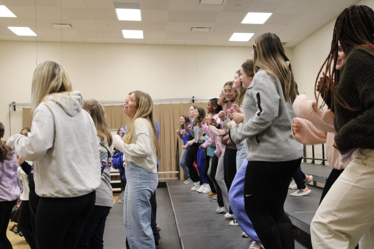 UPA members dance and sing together in preparation for the upcoming holiday choir show at a rehearsal on Nov. 13. 